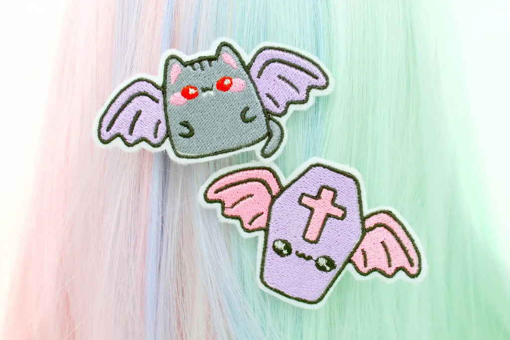 pastel goth Kawaii Goth Winged Coffin And Vampire Cat Hair Clip Set